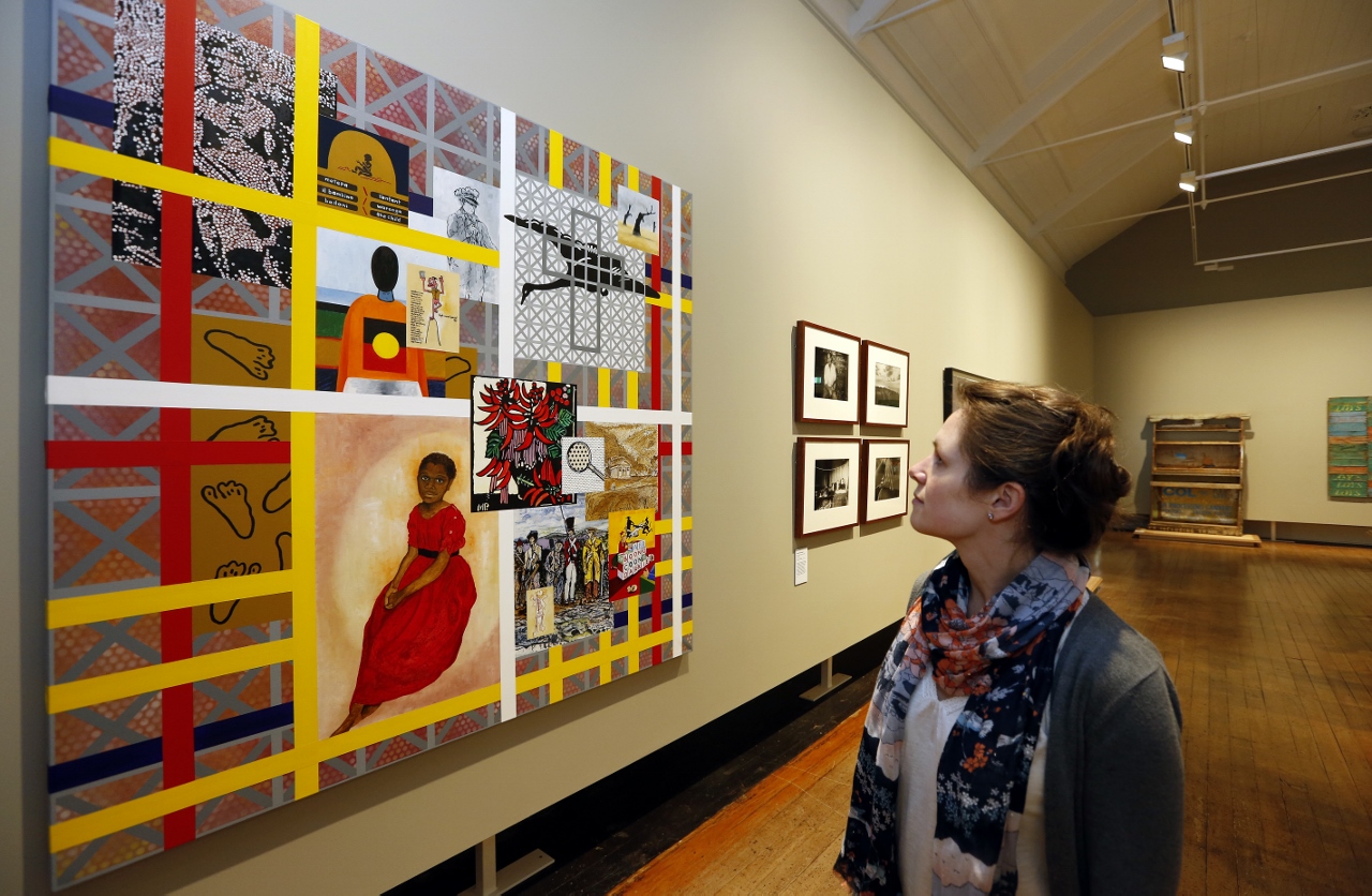 Woman looking at art at TMAG gallery