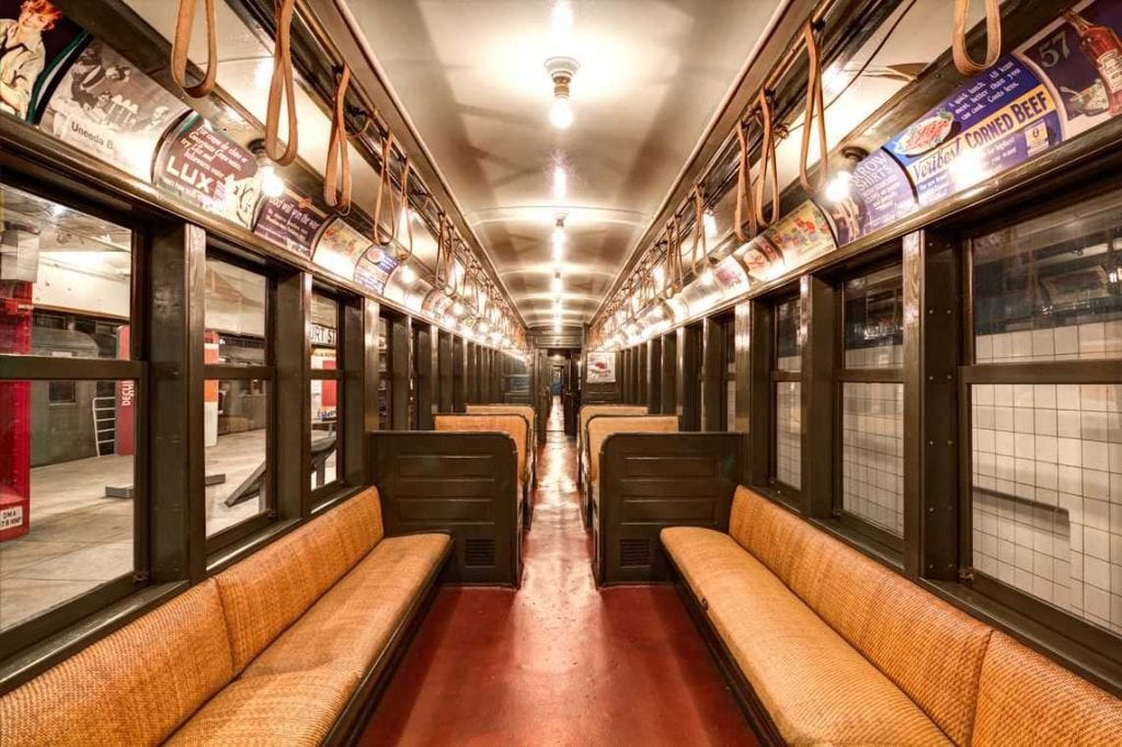 Photo of the interior of a train carriage in the New York Transit Museum